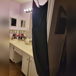 Never worn LBD with open back, in excellent condition.